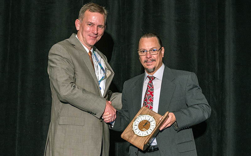 Erik Loehr receives the Osterberg Award.